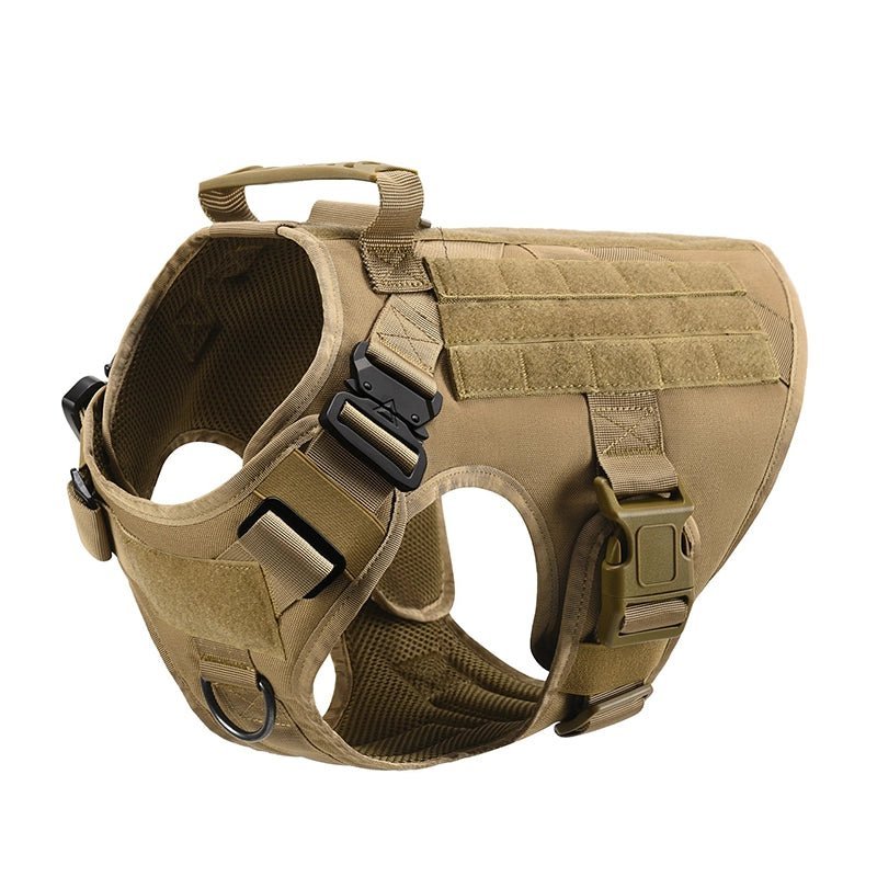 Brown tactical dog harness with handle, adjustable straps, and metal D-ring on a white background