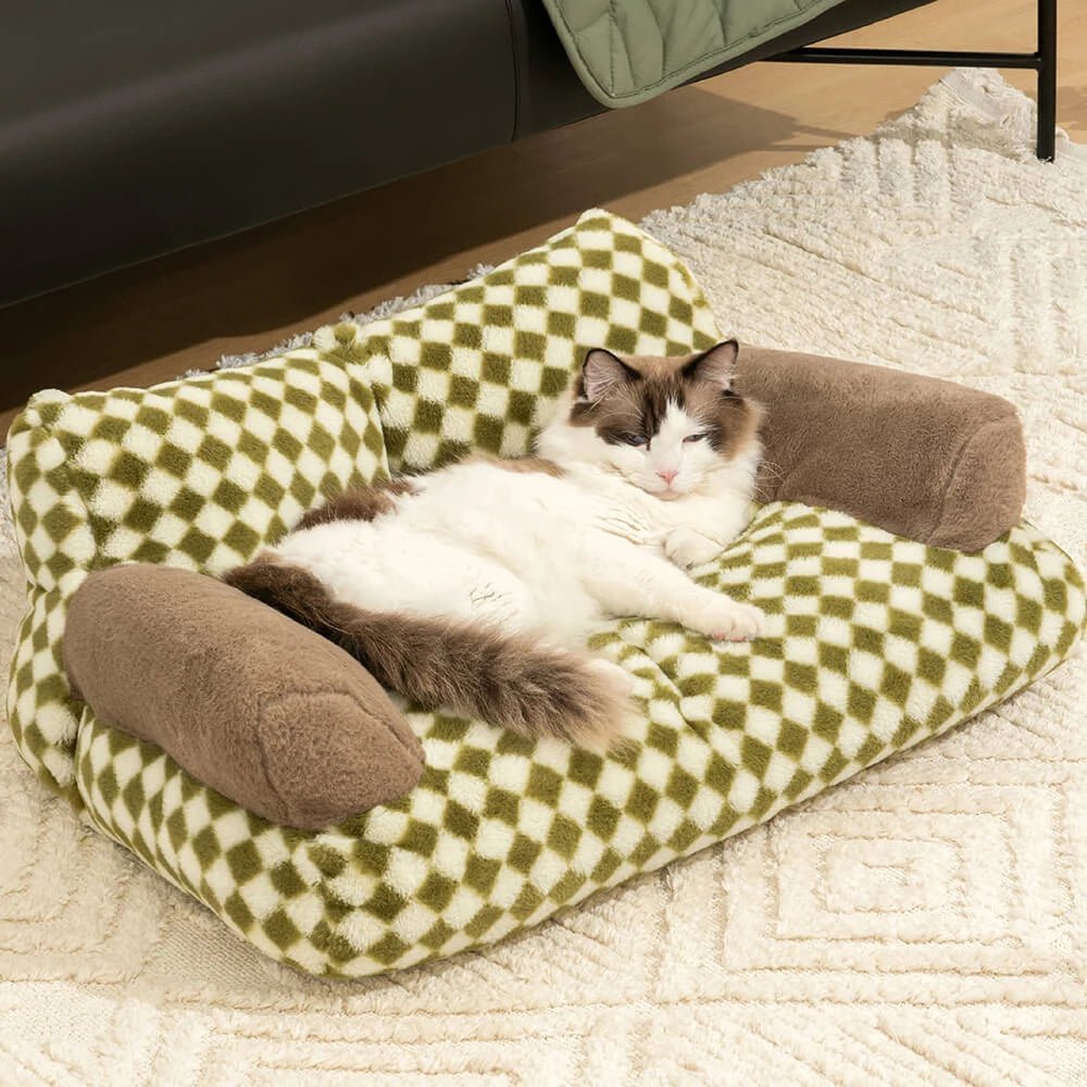 Fluffy cat lounging on a cozy vintage-patterned pet sofa bed, providing comfort and style for pets and home interiors.