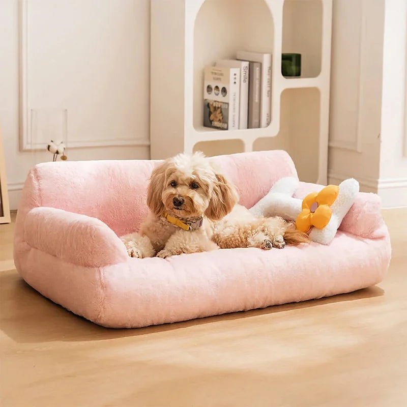 Small dog lounging on a pink vintage-style plush pet sofa bed, perfect for luxurious pet comfort and stylish home decor.