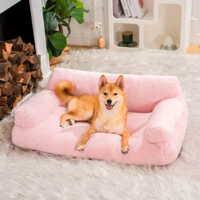 Shiba Inu lounging on a pink vintage-style plush pet sofa bed, providing comfort and style for pets.