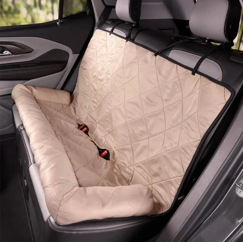 Beige waterproof dog car seat cover with built-in pillow, offering comfort and protection for your backseat during travels.