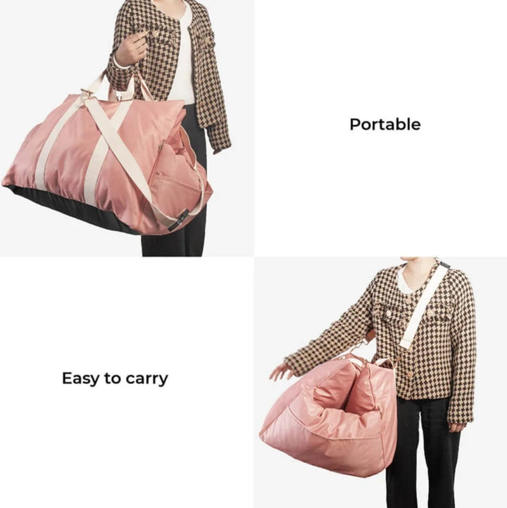 Woman carrying front car seat for pets in hand and on shoulder