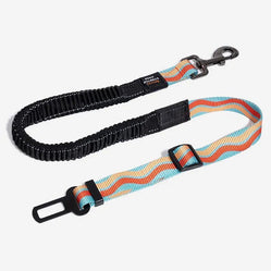 Wavy pattern pet car seat belt in blue and red with elastic strap.