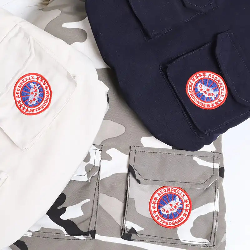 White, navy, and camouflage options for a warm dog jacket for winter with flap pockets and round patches